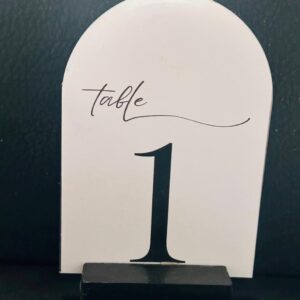 White arched black font table number