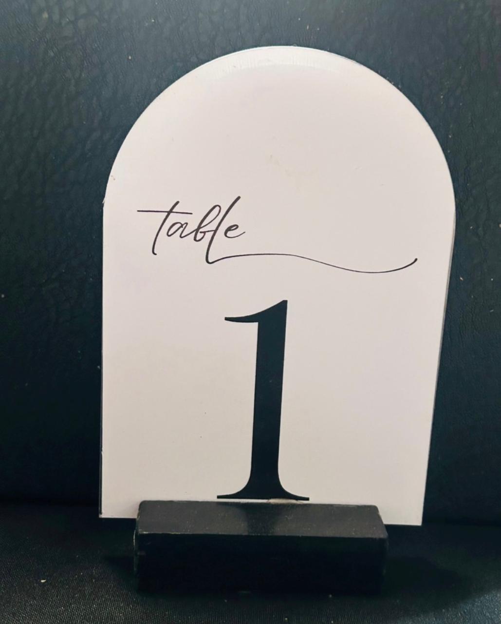 White arched black font table number