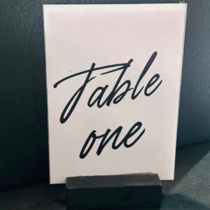 White rectangular black font table number