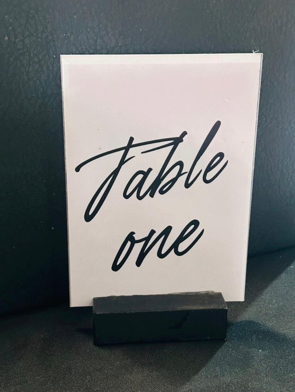 White rectangular black font table number