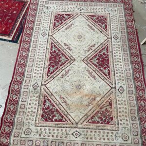 Beige and red Persian carpet