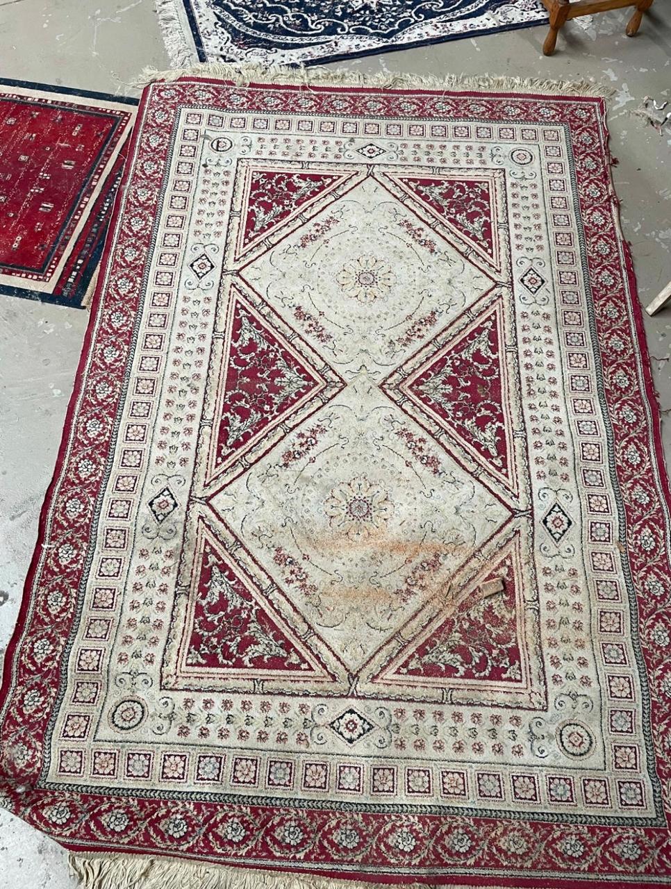 Beige and red Persian carpet